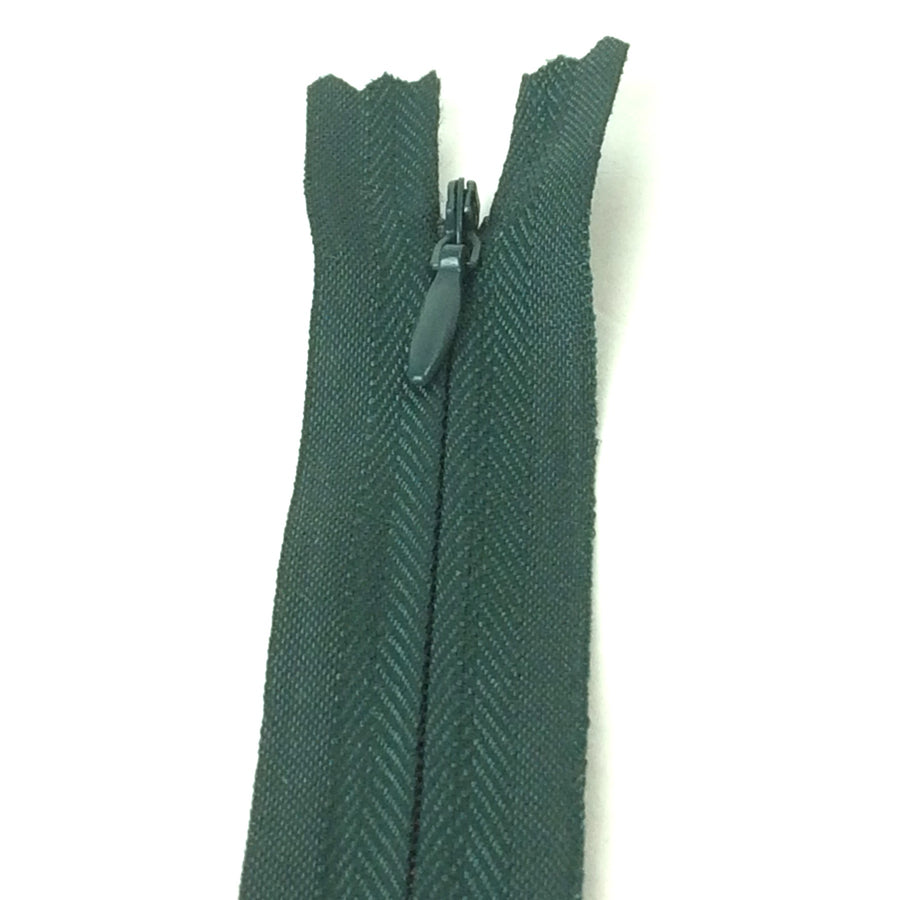 Photo of darlk bottle green invisible or concealed zips available in many different colours and sizes. Great for achieving a professional finish in your products. Invisible zippers are perfect for dressmaking, cushions, crafts, etc., where you don't want your zipper showing. Installing them can be tricky without the right foot on your machine; a normal zipper foot is for installing standard zippers, while you will need an invisible zipper foot for a professional result