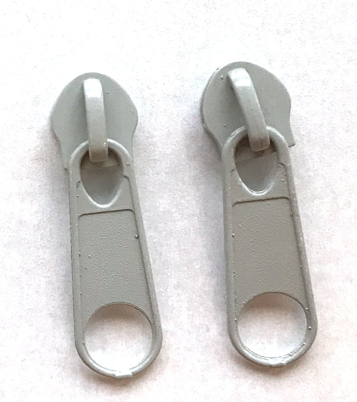 Light grey continuous long chain zipper tape and sliders