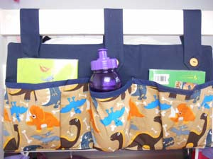 bed tidy for holding books and bottles in a cabin or bunk bed