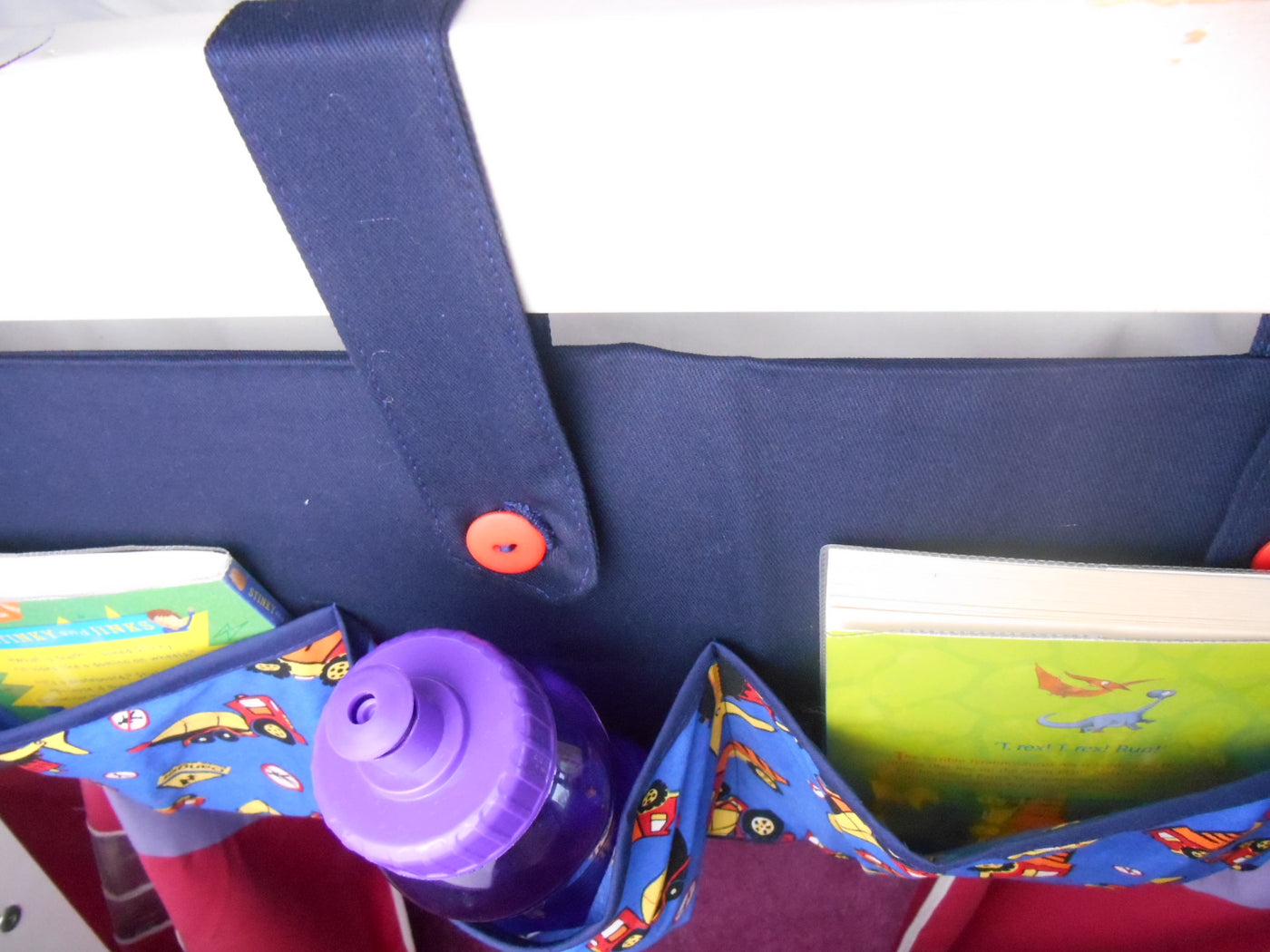 bed tidy for holding books and bottles in a cabin or bunk bed