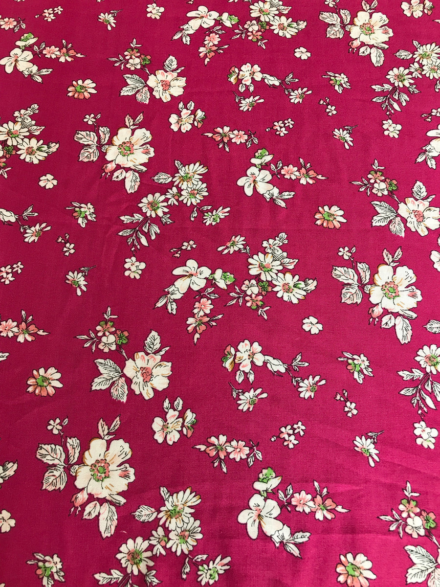 Cerise flowered viscose fabric for dressmaking
