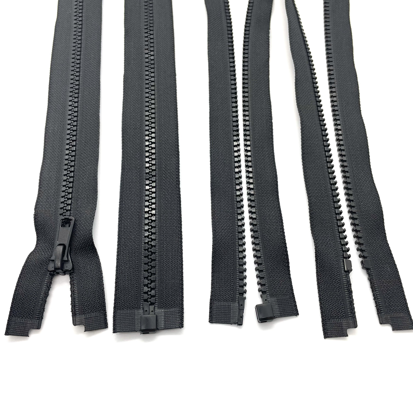 black Chunky open-ended zippers in Size 5: Robust and reliable zippers designed for heavy-duty applications. The chunky design ensures durability and strength, suitable for projects requiring sturdy closures. With open-ended functionality, they offer accessibility and ease of use for jackets, bags, and outdoor gear. Size 5 provides ample width for secure fastening, making these zippers ideal for projects that demand both style and substance.
