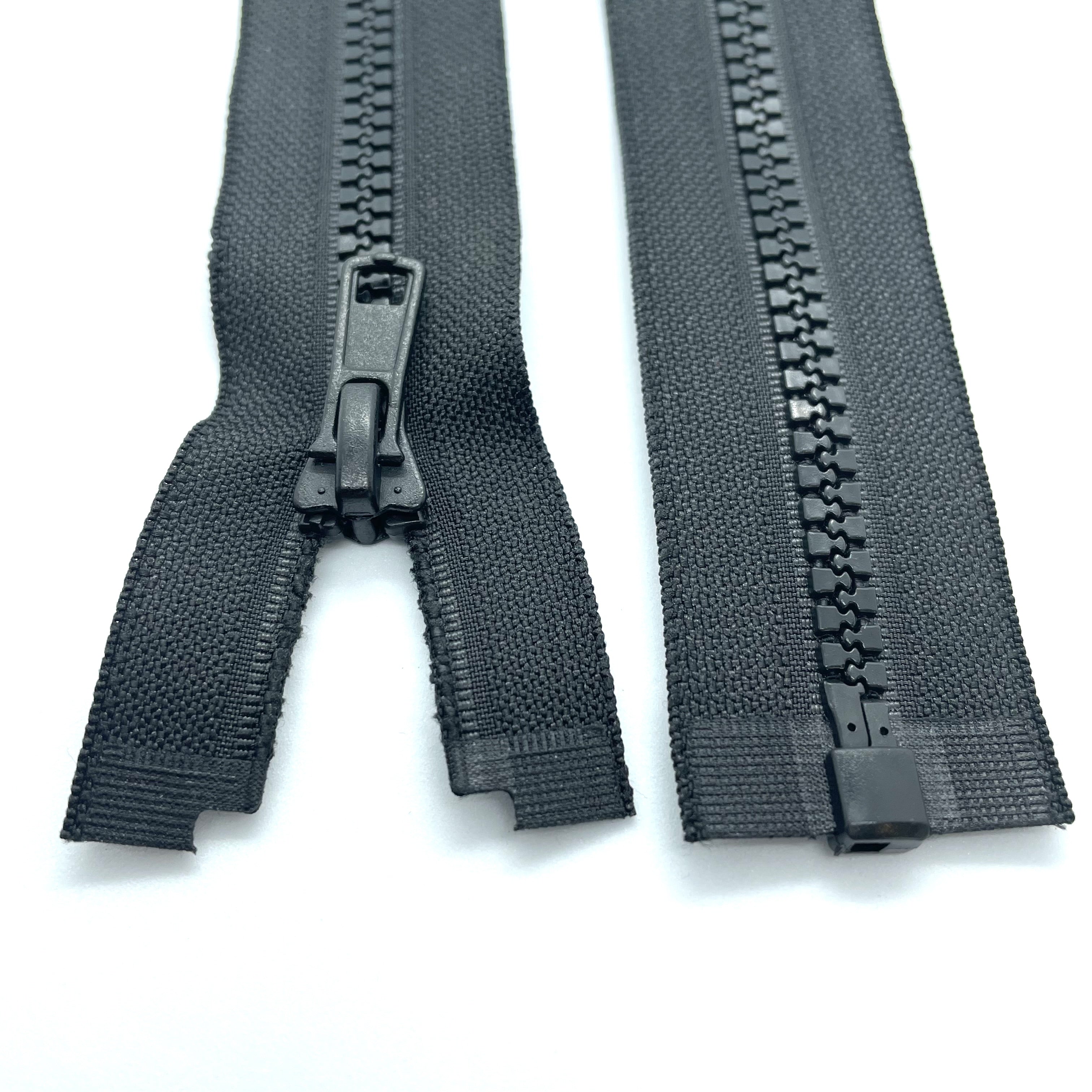 black Chunky open-ended zippers in Size 5: Robust and reliable zippers designed for heavy-duty applications. The chunky design ensures durability and strength, suitable for projects requiring sturdy closures. With open-ended functionality, they offer accessibility and ease of use for jackets, bags, and outdoor gear. Size 5 provides ample width for secure fastening, making these zippers ideal for projects that demand both style and substance.