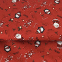 Christmas red fabric featuring Santa and Pengiuns