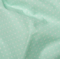 Mint spotted cotton fabric by rose and hubble