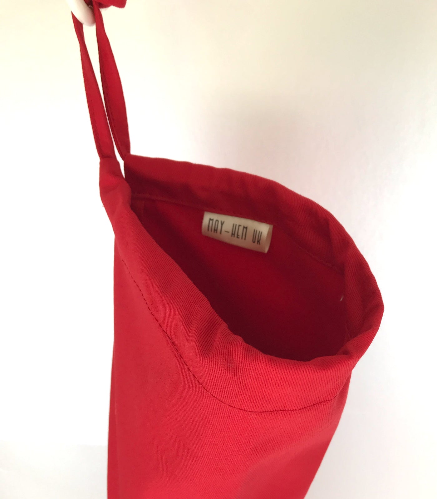 Red plastic bag holder dispenser with draw string