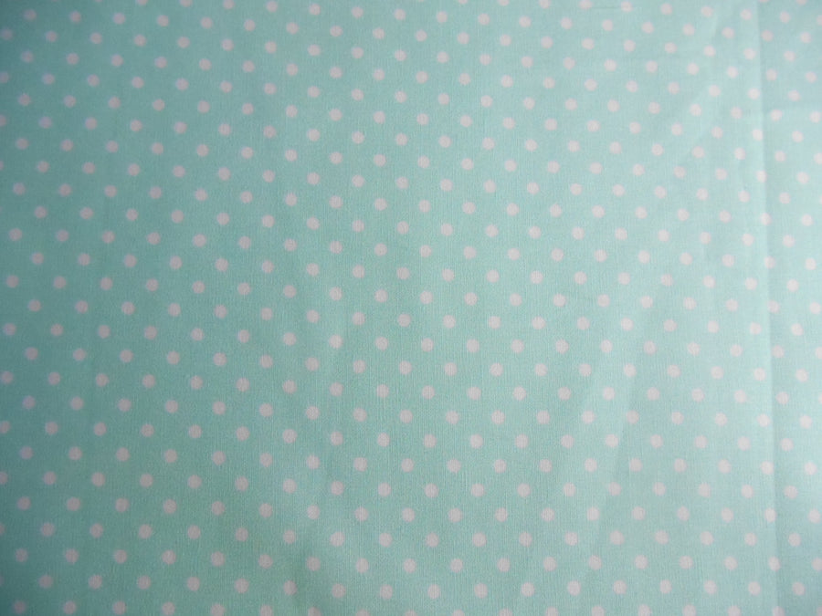 Mint spotted cotton fabric by rose and hubble