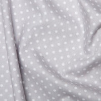 silver or grey spotted cotton fabric by rose and hubble