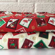 Christmas cotton fabrics with a festive stamps theme