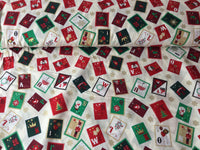 Christmas cotton fabrics with a festive stamps theme