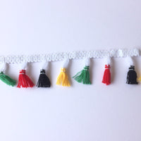 Black, yellow red and green tassle fringe trim